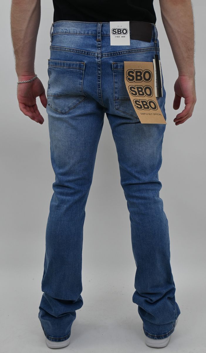 LIGHT BLUE STACKED JEANS WITH RIP AND TEAR