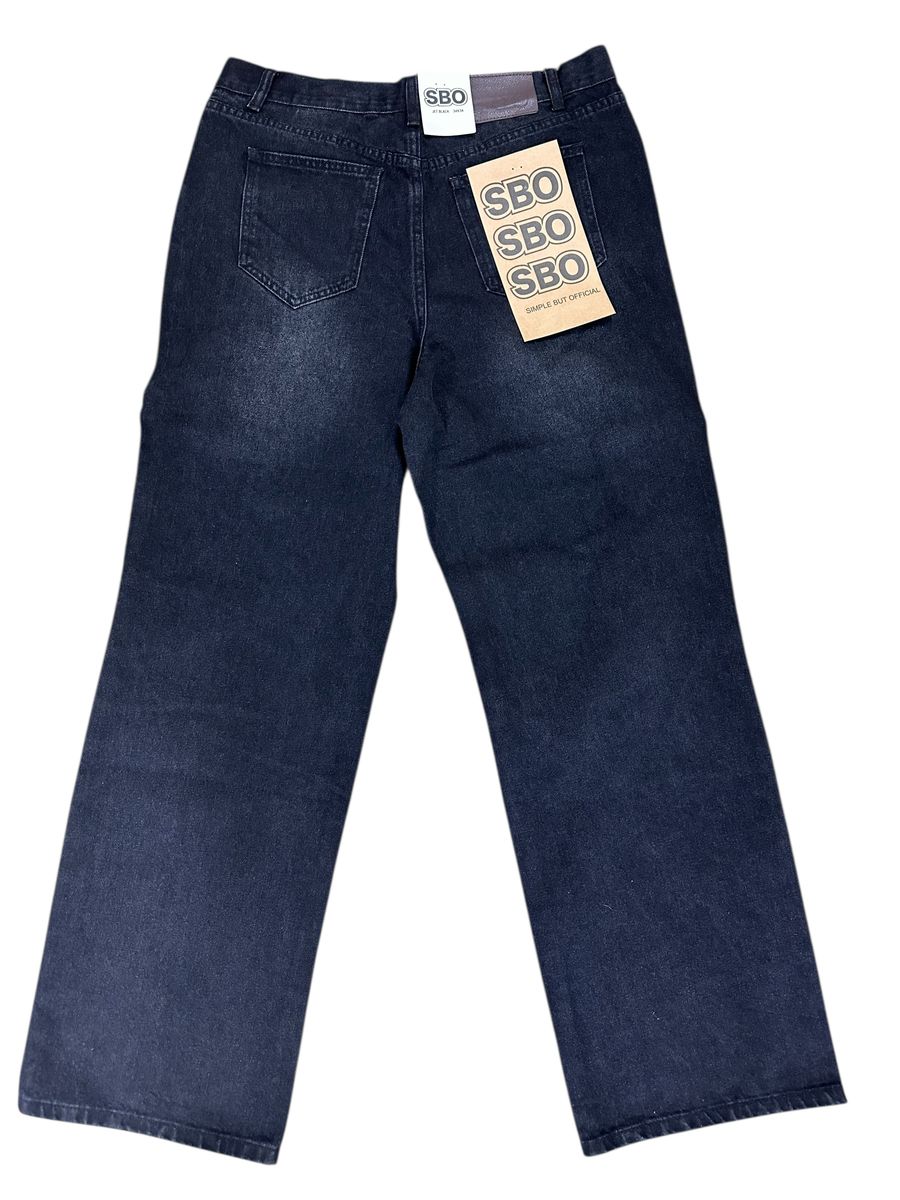 JET BLACK RIPPED BAGGY JEANS