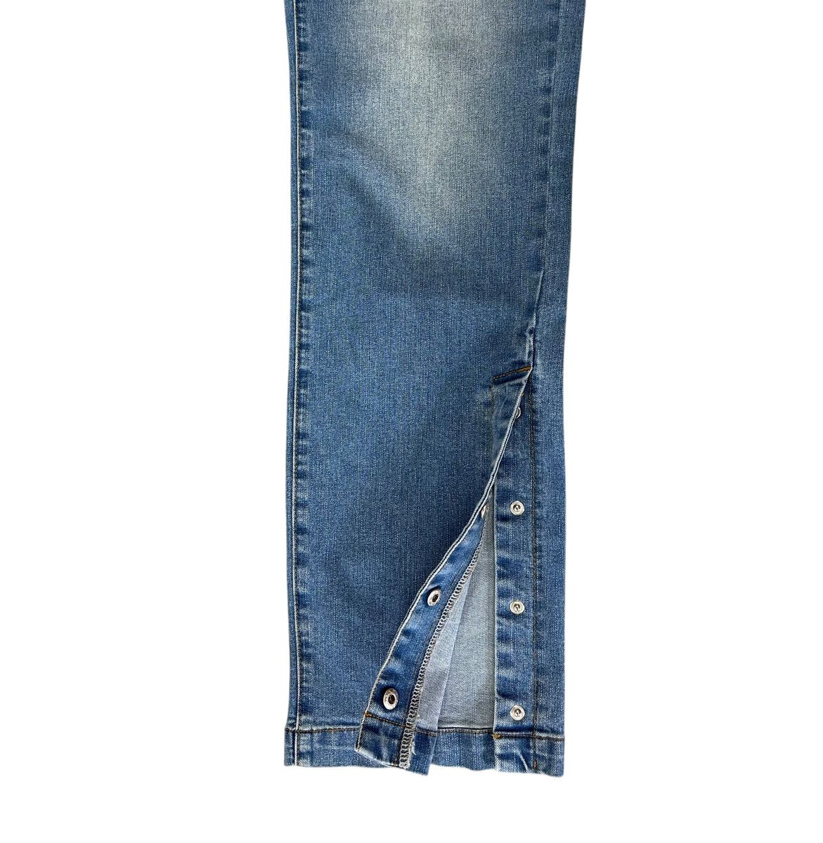 LIGHT BLUE SLIM JEANS WITH HEM SNAP